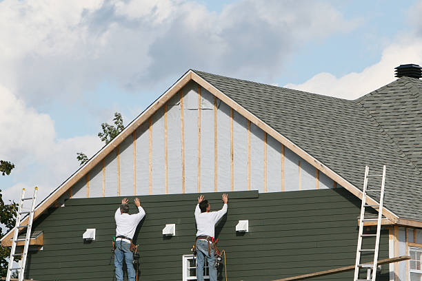 Professional Siding technician working in Reinholds, PA